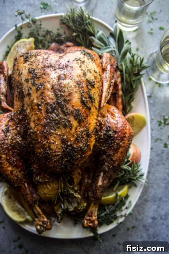 Easy Herb Butter Roasted Turkey 3 Easy Roasted Turkey with Herb Butter on a serving platter