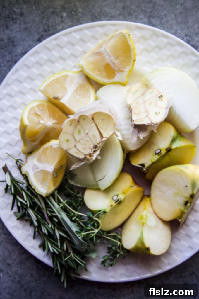 Easy Herb Butter Roasted Turkey 6 Ingredients used to stuff the turkey: lemon, apple, onion, garlic, and fresh herbs