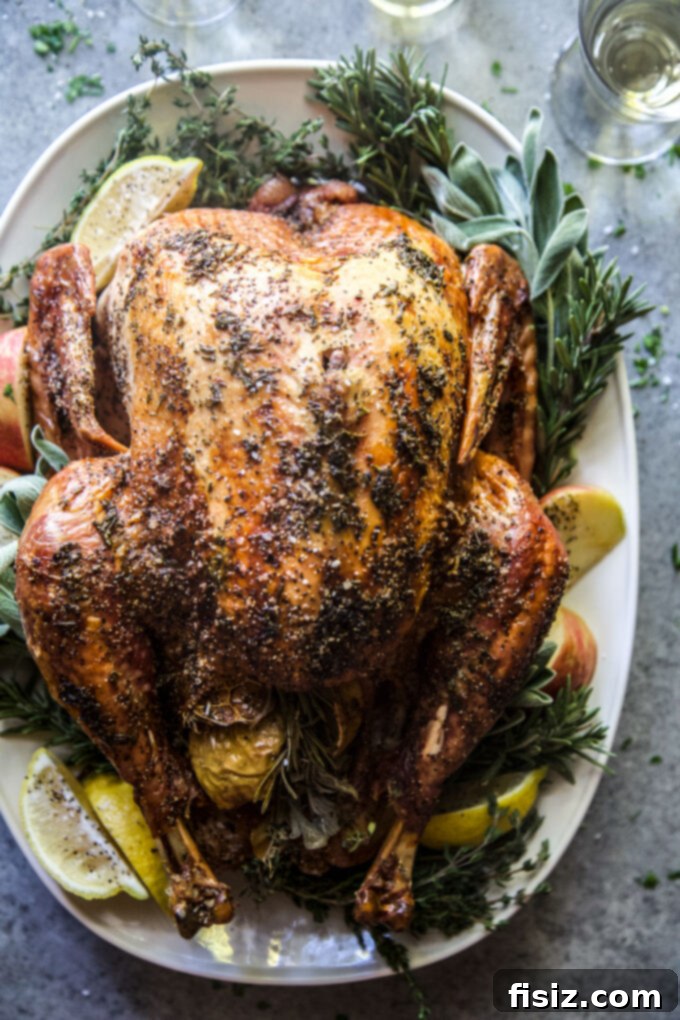 Easy Herb Butter Roasted Turkey 8 Close-up of turkey breast being rubbed with herb butter under the skin