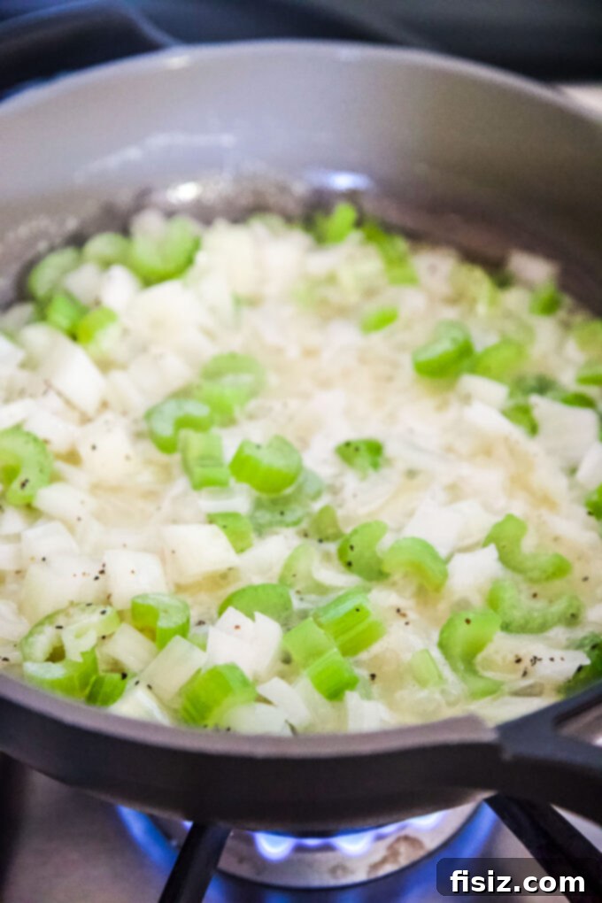 Grandma's Secret Stuffing 7 Celery and onion sauteing in a skillet with butter