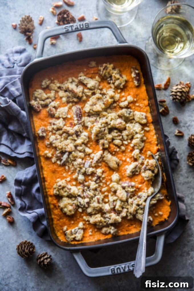 Old-fashioned sweet potato casserole in a baking dish, ready to be served on a holiday table.