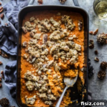 Old-fashioned sweet potato casserole with a golden pecan streusel topping.