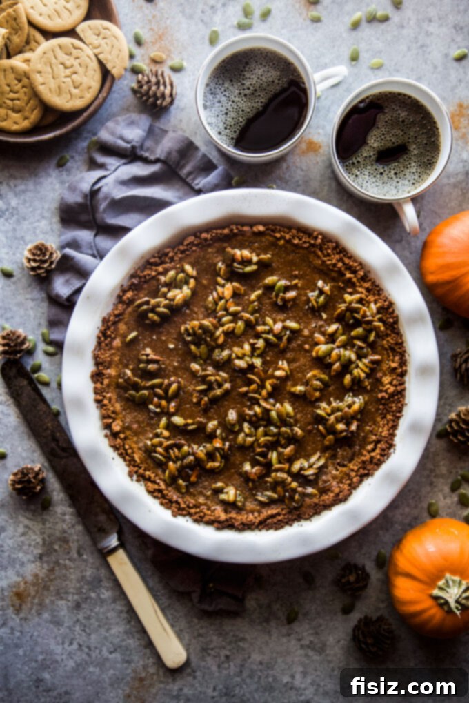 Gingersnap-Crusted Pumpkin Pie with Candied Pepitas 11 Close-up of a perfectly baked Pumpkin Pie with Gingersnap Crust and Candied Pepitas.