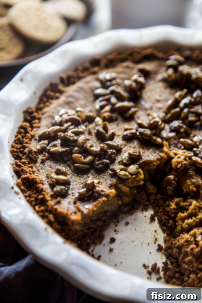 Gingersnap-Crusted Pumpkin Pie with Candied Pepitas 10 Slice of Pumpkin Pie with Gingersnap Crust, Candied Pepitas, and Whipped Cream.