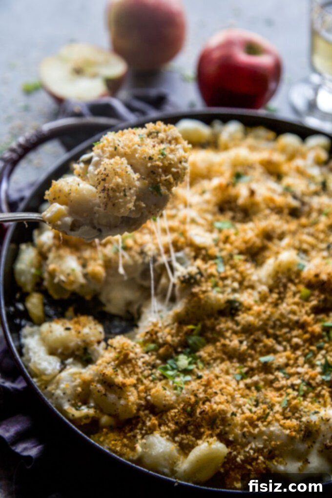 Smoky Cheddar Apple and Poblano Gnocchi Bake 10 A serving of Apple & Poblano Gnocchi Bake, garnished with fresh herbs, ready to be enjoyed.