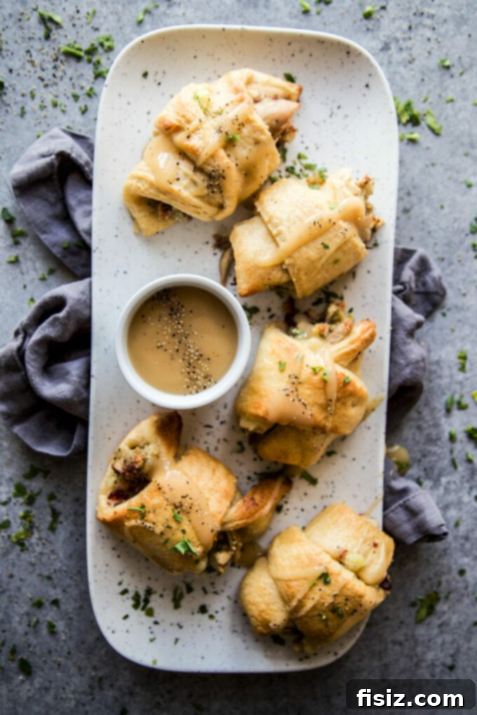 Reinvent Your Thanksgiving Leftovers: 15+ Easy Recipes 3 Thanksgiving Leftovers in a Blanket – A cozy and easy lunch idea featuring turkey and stuffing wrapped in flaky pastry.