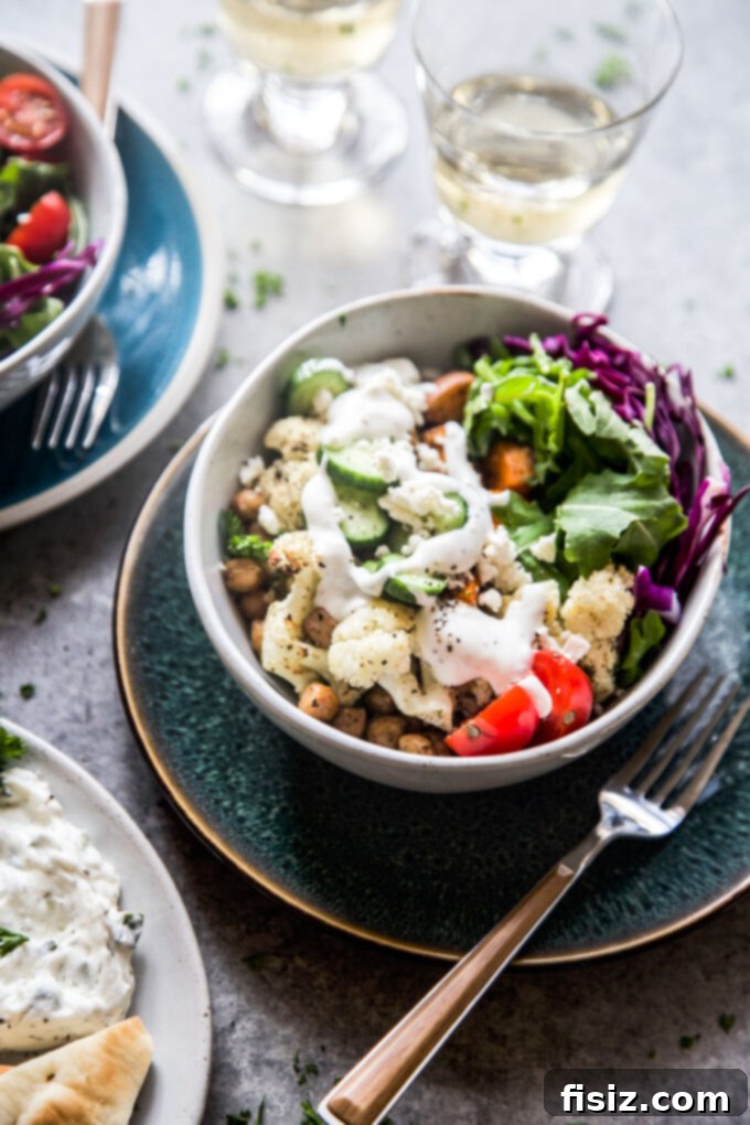 Zaatar Roasted Veggie Bowls with Zesty Lemon Yogurt 3 Close-up of a stunning Roasted Veggie Za’atar Bowl, showcasing roasted vegetables, feta, and fresh toppings.