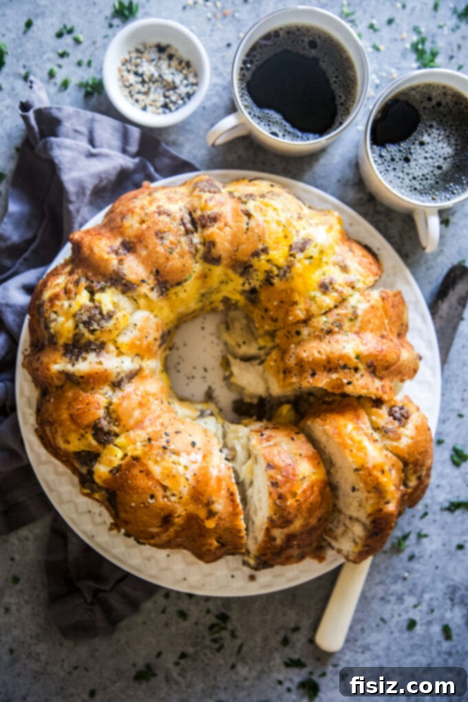Hearty Morning Savory Monkey Bread 2 Savory Breakfast Monkey Bread with fluffy biscuits, creamy eggs, sausage, and gooey cheese
