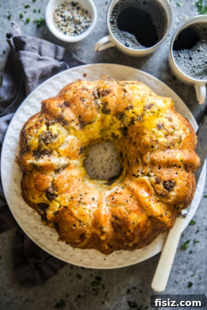 Hearty Morning Savory Monkey Bread 10 Plate of Savory Breakfast Monkey Bread with a piece pulled apart