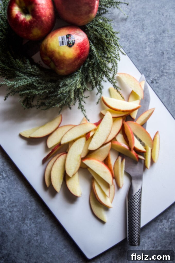 Sausage and Apple Hash with Zesty Whole Grain Mustard 5 sliced apples on a cutting board