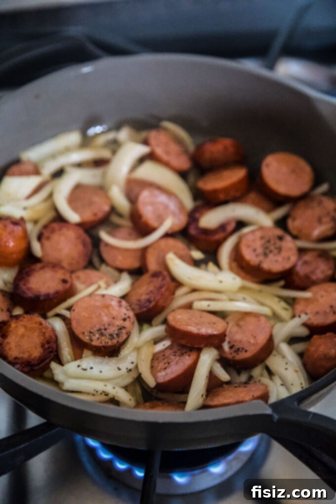 Sausage and Apple Hash with Zesty Whole Grain Mustard 6 sausage and onions in a skillet