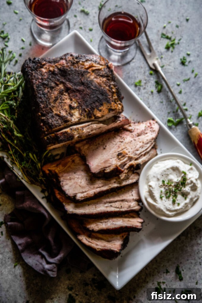 Slow-Roasted Coffee-Rubbed Pork Shoulder 8 Oven Roasted Coffee-Rubbed Pork Shoulder resting on a cutting board.