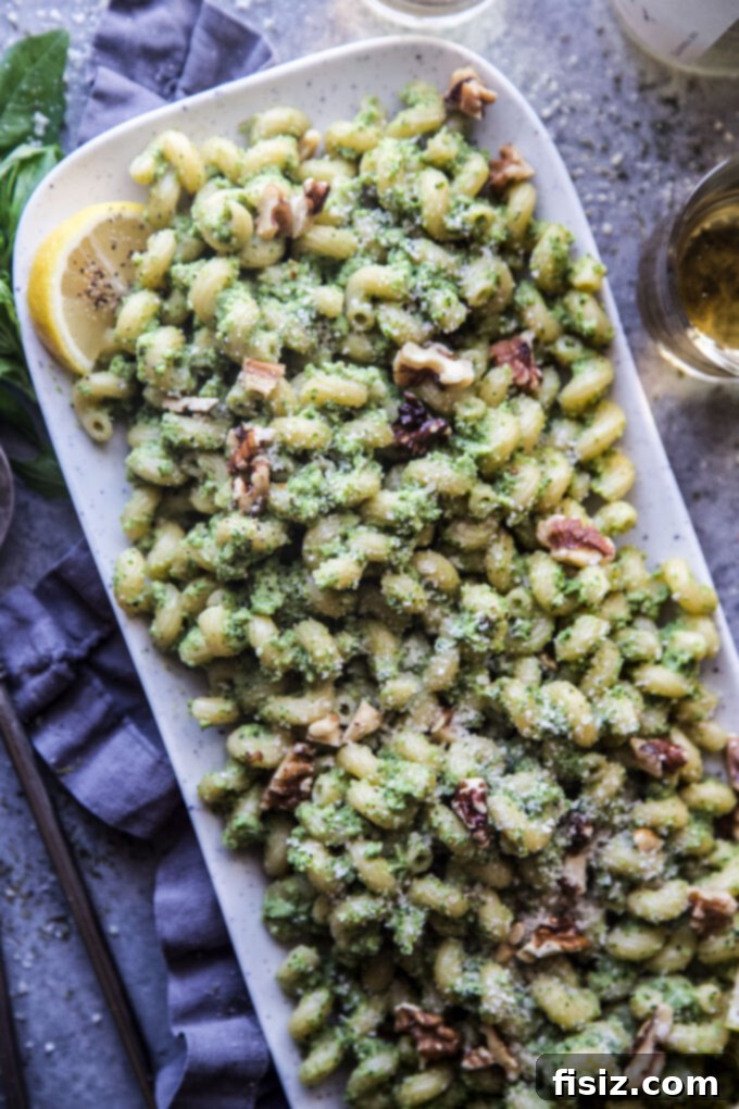 Vibrant Broccoli Walnut Pesto Pasta 7 Broccoli Walnut Pesto Pasta in a serving bowl, garnished with fresh basil and walnuts