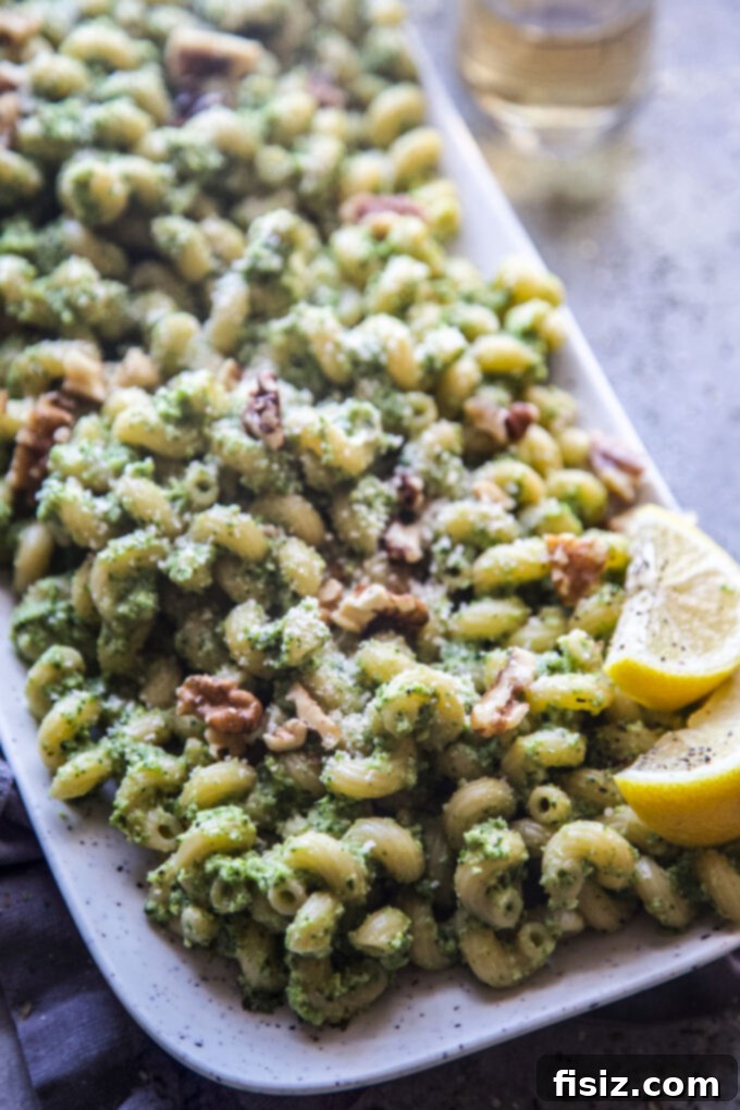 Vibrant Broccoli Walnut Pesto Pasta 8 A close-up shot of a serving of Broccoli Walnut Pesto Pasta with a fork