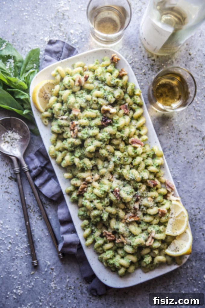 Vibrant Broccoli Walnut Pesto Pasta 9 Overhead shot of Broccoli Walnut Pesto Pasta in a bowl, with a serving of fresh ingredients