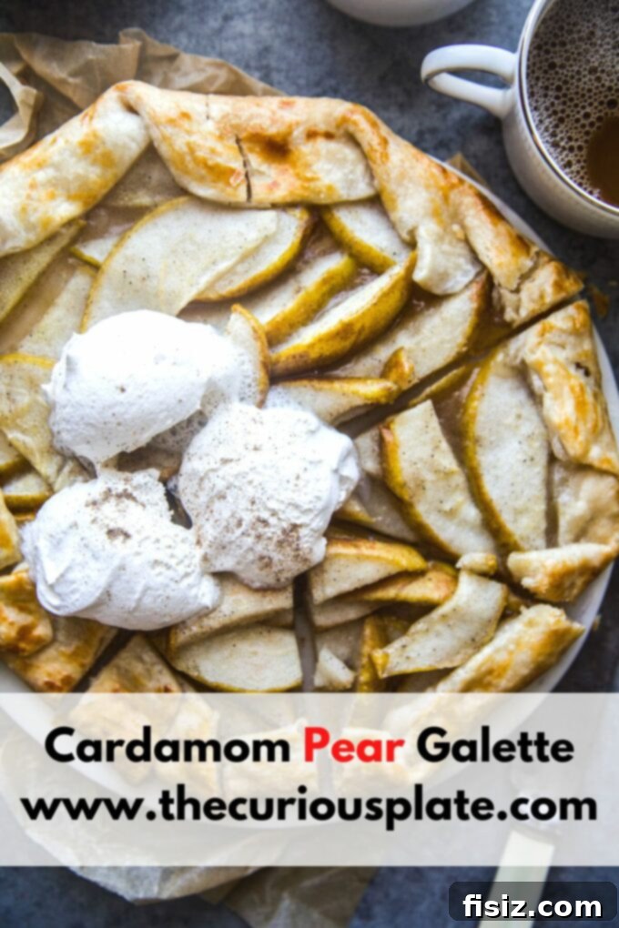 Rustic Cardamom Pear Galette 11 A slice of Cardamom Pear Galette on a plate, garnished with fresh mint and powdered sugar