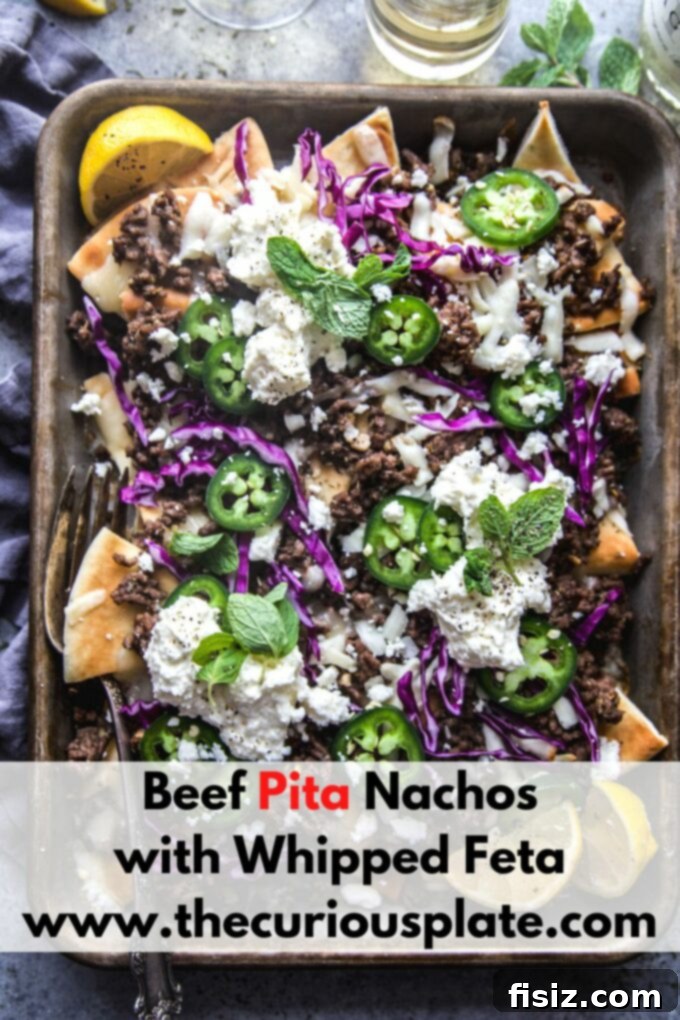 Loaded Beef Pita Nachos with Whipped Feta 11 A final, mouth-watering image of Beef Pita Nachos with Whipped Feta, showcasing the rich colors and textures of all the ingredients, ready to be enjoyed.