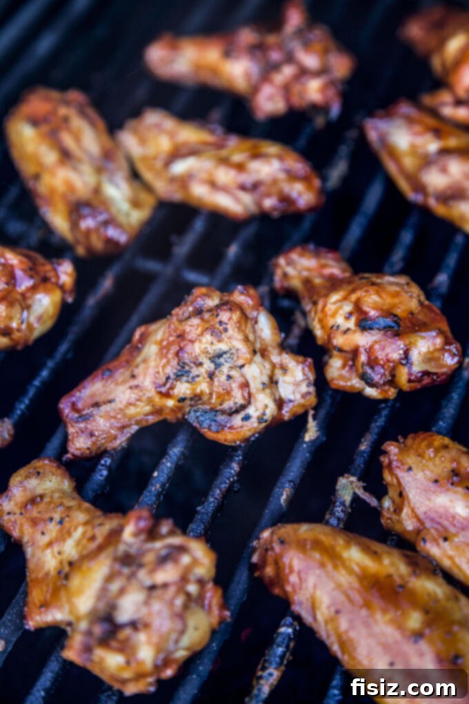 Smoky Gochujang Wings 7 Smoked Korean-Style Hot Wings cooking on the grill