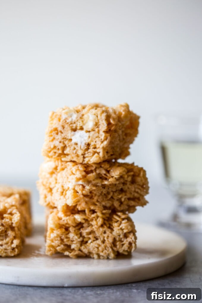 Sparkling Krispie Delights 2 Champagne Rice Krispie Treats - golden squares on a serving plate