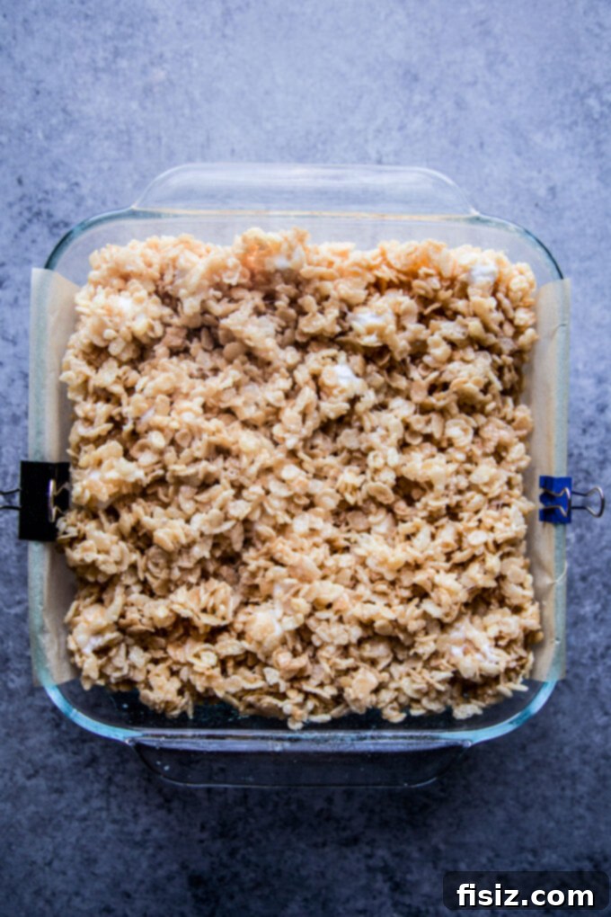 Sparkling Krispie Delights 7 Champagne Rice Krispie Treats chilling in a prepared baking dish
