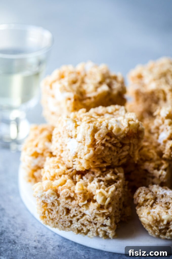 Sparkling Krispie Delights 8 Champagne Rice Krispie Treats - a single treat on a white background, showing its gooey texture