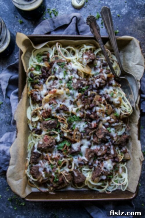 29+ Easy St. Patricks Day Recipes for a Fun Celebration 3 Guinness and Black Bean Chili Loaded Spiralized Fries, a delicious St. Patrick's Day appetizer