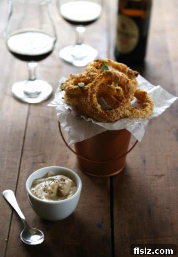 29+ Easy St. Patricks Day Recipes for a Fun Celebration 6 Oven Fried Guinness Onion Rings with Stout Gravy, a savory St. Patrick's Day side dish
