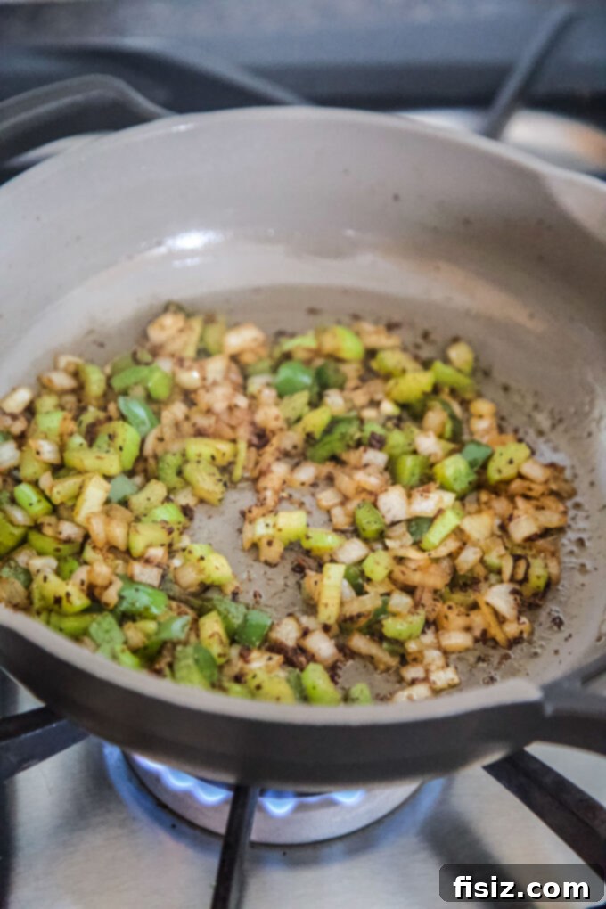 Bayou Spiced Shrimp with Creamy Polenta 5 Diced celery, onion, and green pepper (Cajun Trinity) sautéing in a skillet.