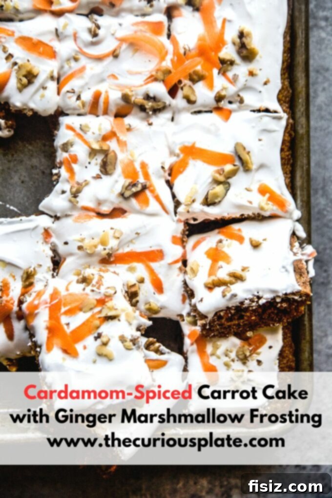 Lush Cardamom Carrot Cake with Zesty Ginger Marshmallow Frosting 11 Beautifully decorated Cardamom-Spiced Carrot Cake with Ginger Marshmallow Frosting on a stand