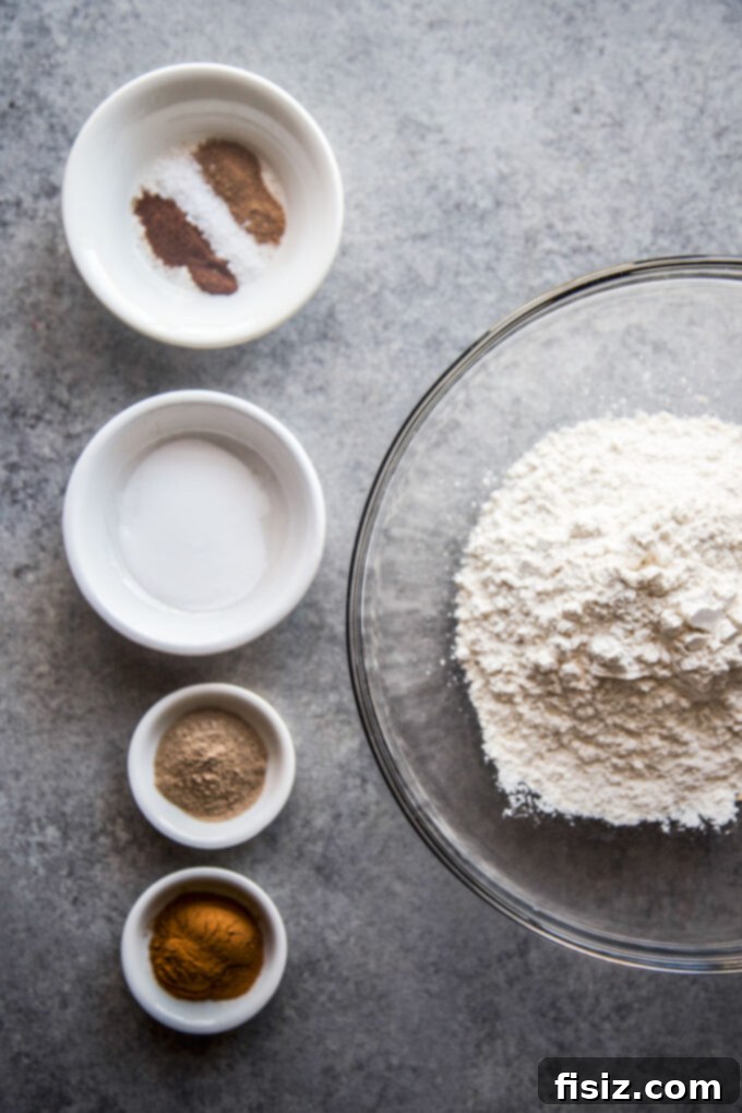 Lush Cardamom Carrot Cake with Zesty Ginger Marshmallow Frosting 4 Dry ingredients for cardamom carrot cake, including flour and spices