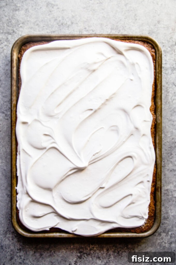 Lush Cardamom Carrot Cake with Zesty Ginger Marshmallow Frosting 7 Cardamom carrot cake completely frosted with ginger marshmallow frosting