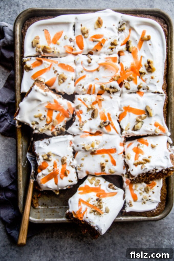Lush Cardamom Carrot Cake with Zesty Ginger Marshmallow Frosting 8 Close-up of a slice of Cardamom-Spiced Carrot Cake with fluffy Ginger Marshmallow Frosting