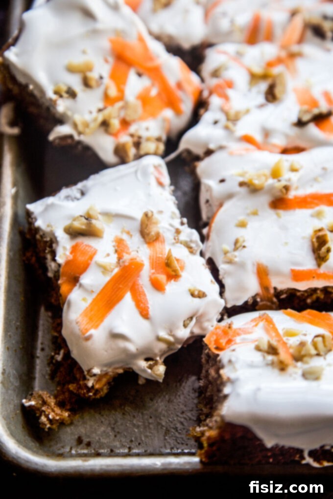 Lush Cardamom Carrot Cake with Zesty Ginger Marshmallow Frosting 9 Generous slice of Cardamom-Spiced Carrot Cake with Ginger Marshmallow Frosting