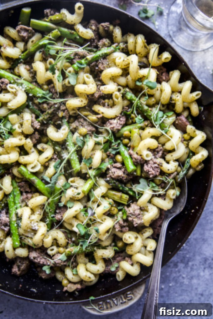Tender Lamb Pasta with Vibrant Spring Pesto 8 A vibrant bowl of Spring Pesto Lamb Pasta, garnished with fresh herbs