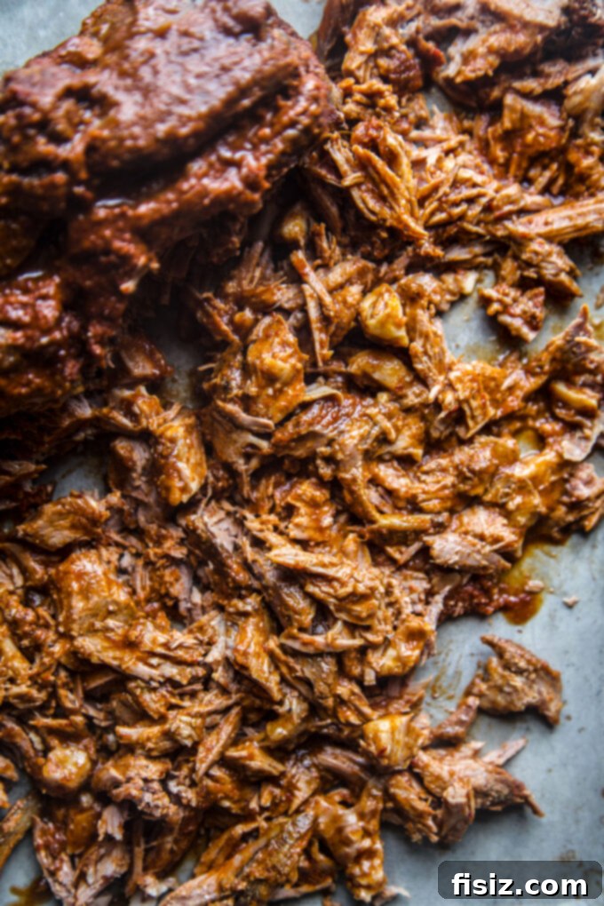 Melt-in-Your-Mouth Slow Cooker Al Pastor Lamb Tacos 11 Perfectly shredded Al Pastor boneless lamb shoulder, tender and juicy