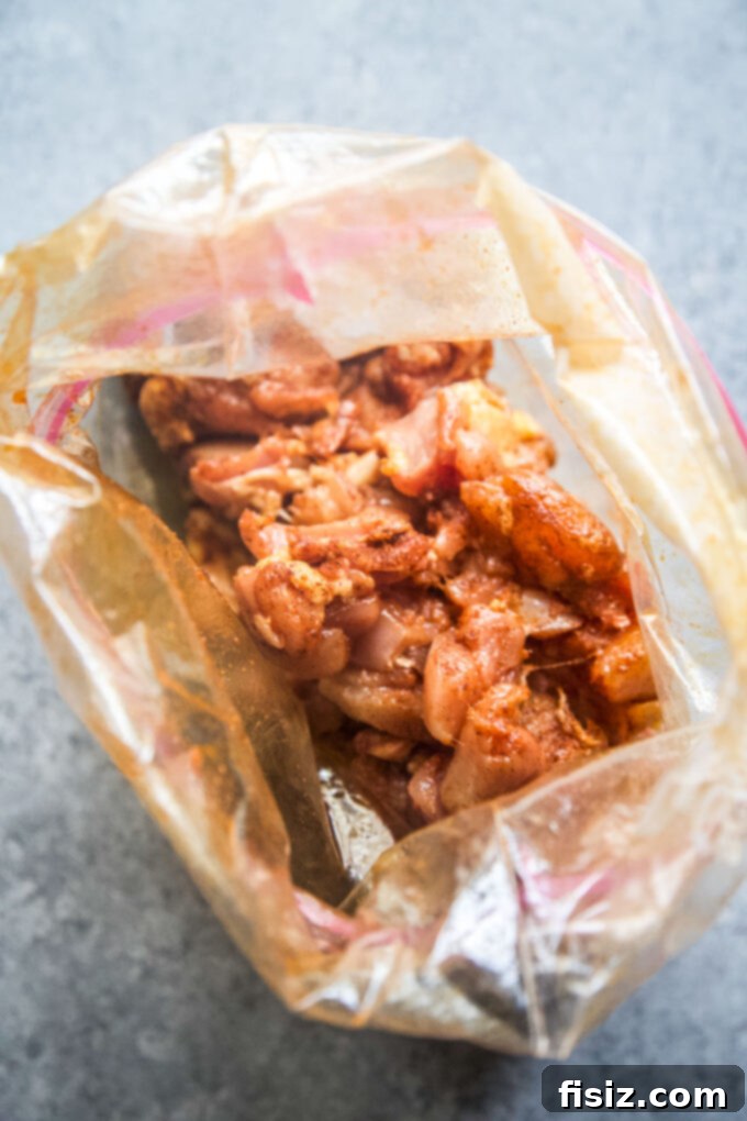 Twice-Baked Chicken Shawarma Potatoes 5 Chicken shawarma marinating in a plastic bag with spices and lemon