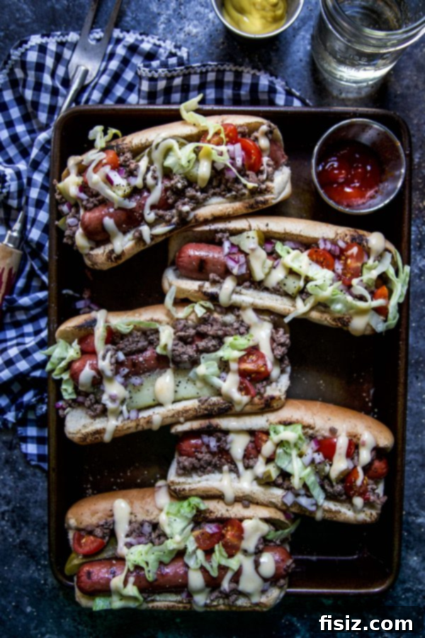 49 Must-Make Recipes For A Perfect June 8 Loaded Cheeseburger Hot Dogs, a creative hot dog recipe for summer cookouts