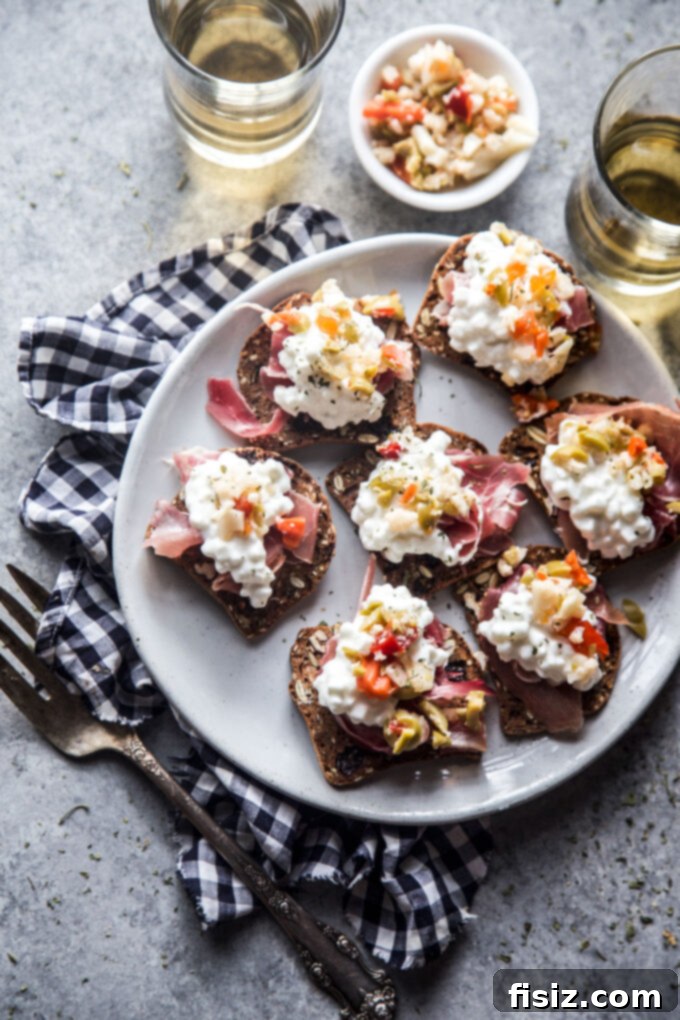 Prosciutto and Giardiniera Cottage Cheese Cracker Bites 12 Assortment of Cottage Cheese Cracker Bites on a serving board
