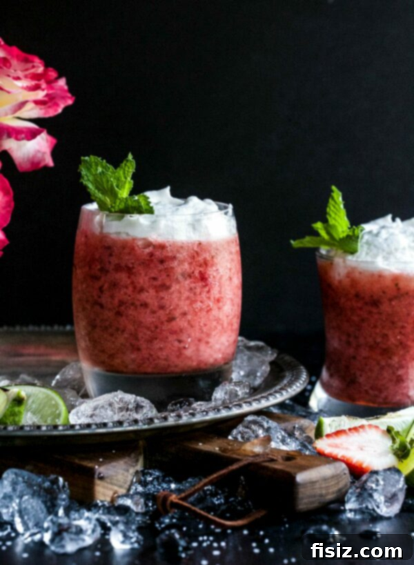 56 Sizzling July Recipes for a Delicious Summer 9 Roasted Strawberry & Rosé Margarita with Coconut Whipped Cream - A beautiful and refreshing summer cocktail