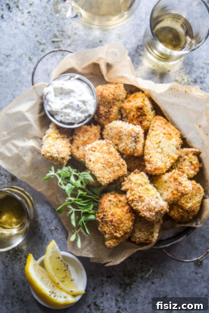 Crispy Air Fryer Greek Salmon Bites 2 Air Fryer Greek Salmon Bites served with a side of tzatziki and fresh herbs