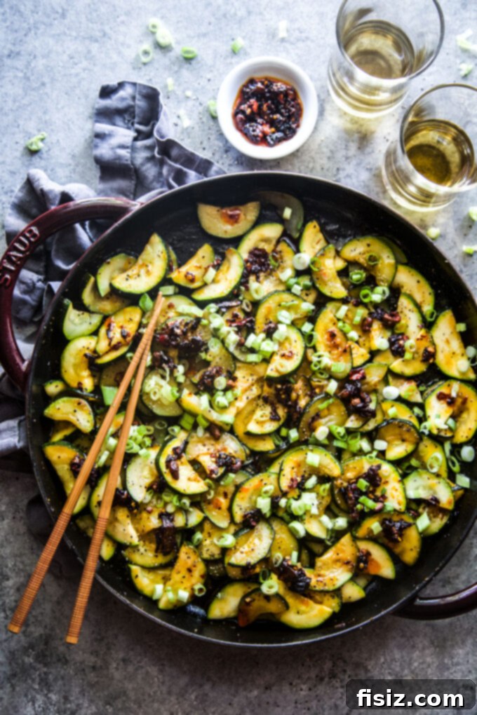 Chili Crisp Zucchini Sizzle 7 Stylishly arranged spiced zucchini with chili crisp and a hint of fresh herbs.