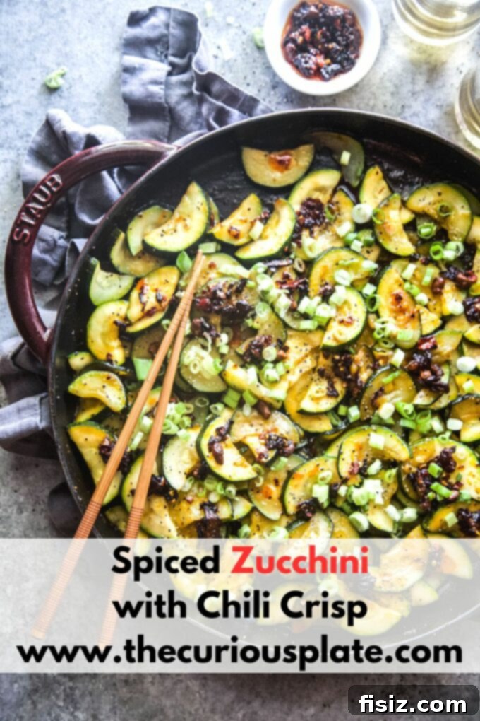 Chili Crisp Zucchini Sizzle 10 A close-up of Spiced Zucchini with Chili Crisp, highlighting the appetizing texture and garnish.