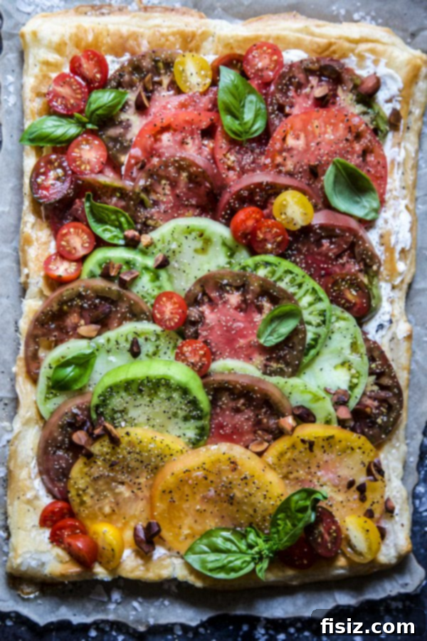 46 Must-Try August Recipes 5 Easy Tomato Tart with Almond Vinaigrette, a light and elegant summer dish.