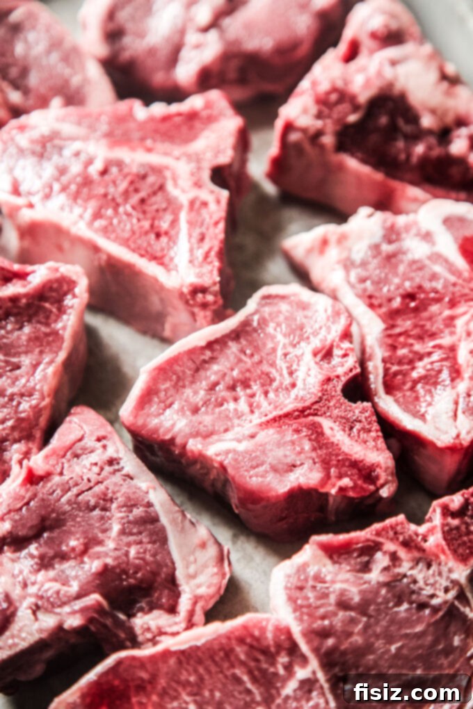Spicy Jerk Lamb Loin Chops, Sweet Peach Salsa 4 Nutrient-rich American Lamb Loin Chops ready for grilling