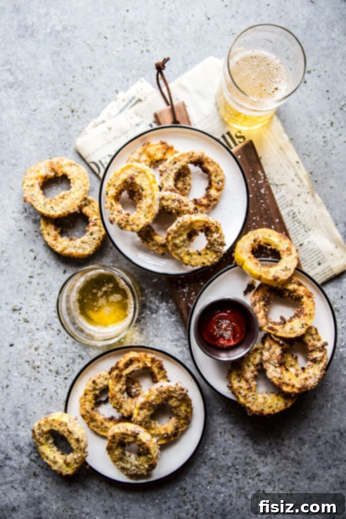 Crispy Air Fryer Squash Rings 10 Stack of Air Fryer Squash Rings on a cutting board, ready to be served