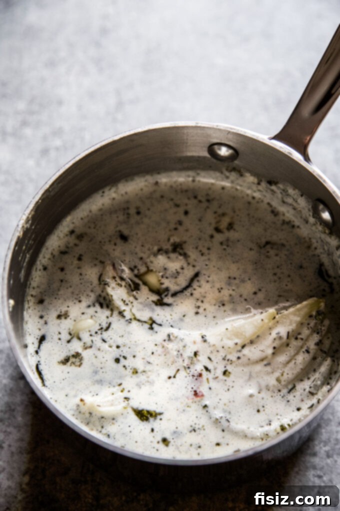 Golden Baked Cabbage Gratin 6 white cream sauce in a saucepan