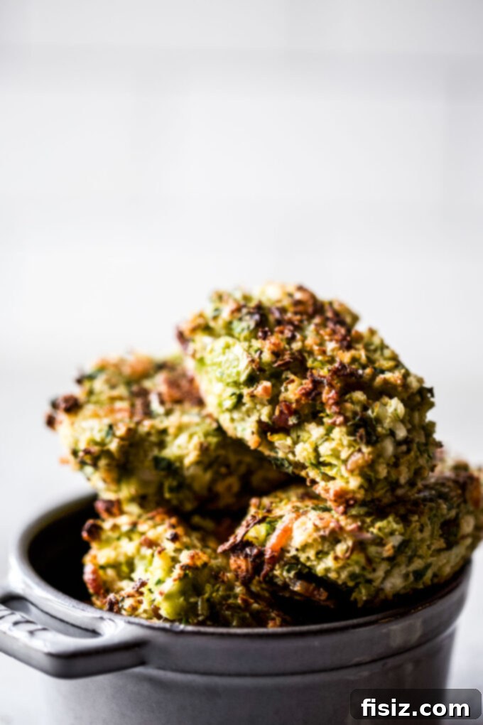 Gourmet Brussels Sprout Bacon Blue Cheese Tots 3 Close-up of baked Bacon Blue Cheese Brussels Sprout Tater Tots on a parchment-lined baking sheet