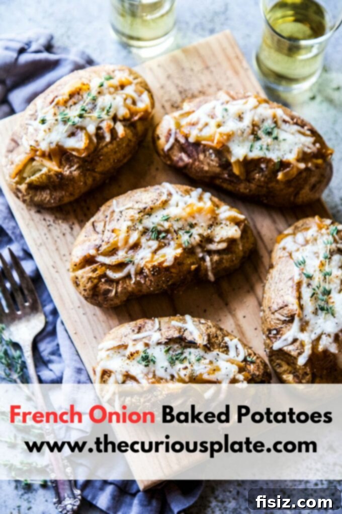 Ultimate French Onion Baked Potatoes 10 A beautifully presented French onion baked potato, highlighting the melted cheese and filling.