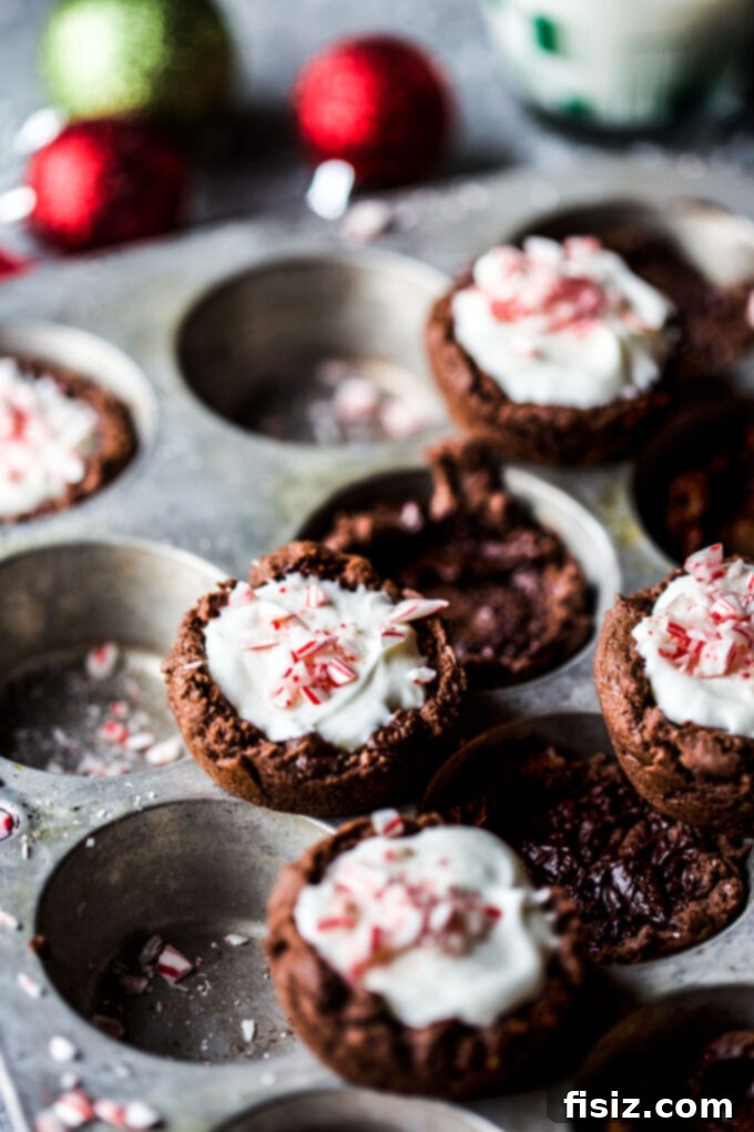 Frosty Peppermint Cream Chocolate Cookie Cups 7 A close-up of a filled chocolate cookie cup with peppermint cream, ready to be enjoyed