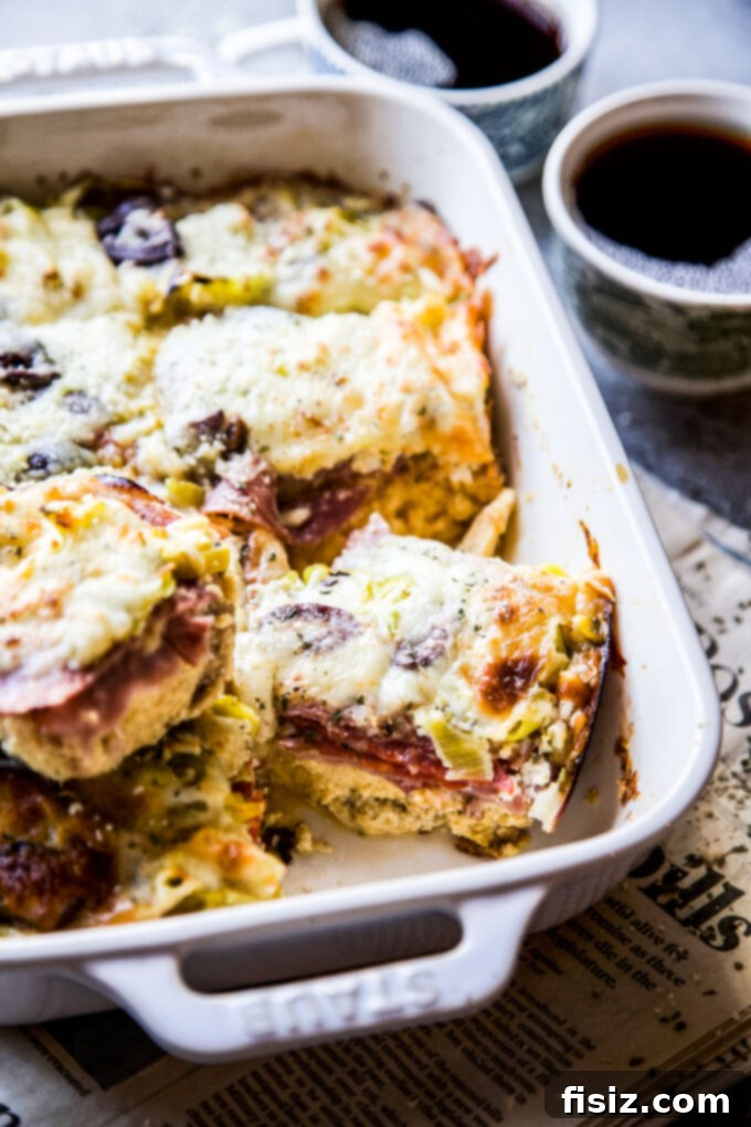 Savory Italian Brunch Bake 3 Close-up of a rustic antipasto platter featuring cured meats, cheeses, olives, and pickled vegetables